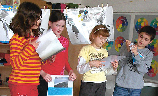 Four children at Eichendorff school presenting on the topic climate.