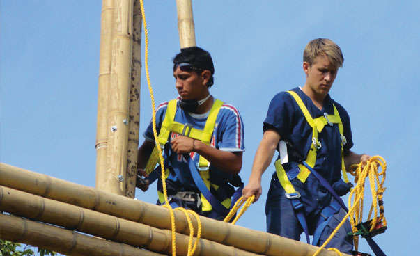 Two young men are building a house.